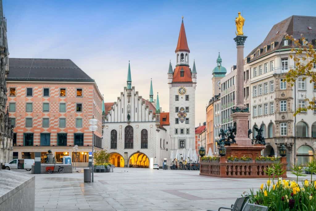 A serene morning view of Marienplatz with the Old Town Hall and other historical buildings in Munich, Germany.